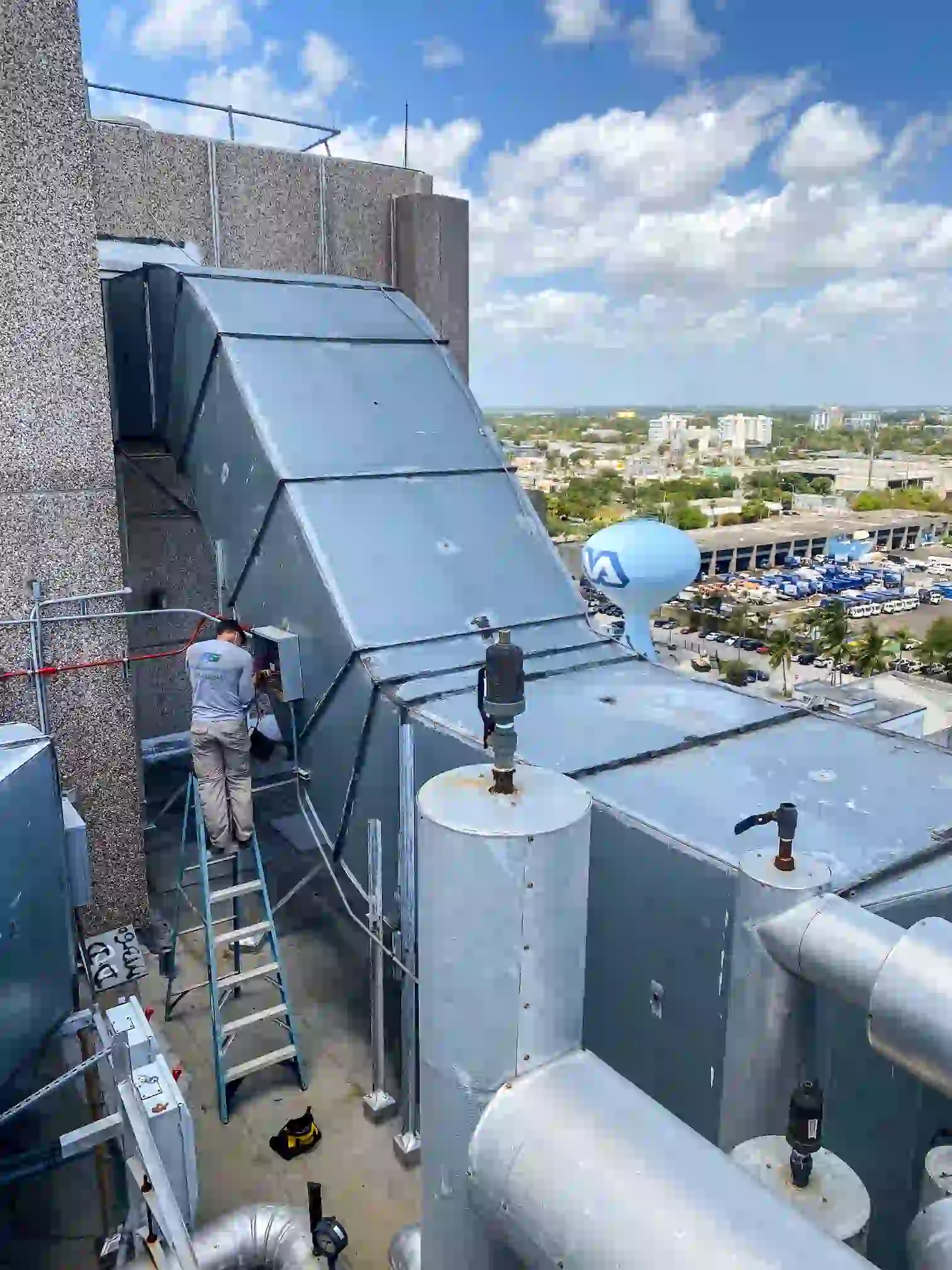 Pilar Services technician completing an A/C maintenance checklist