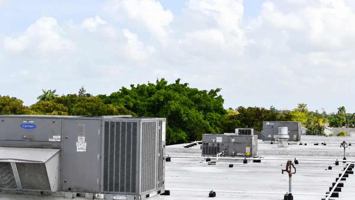 Row of rooftop Carrier package units on a Florida commercial building serviced by Pilar Services